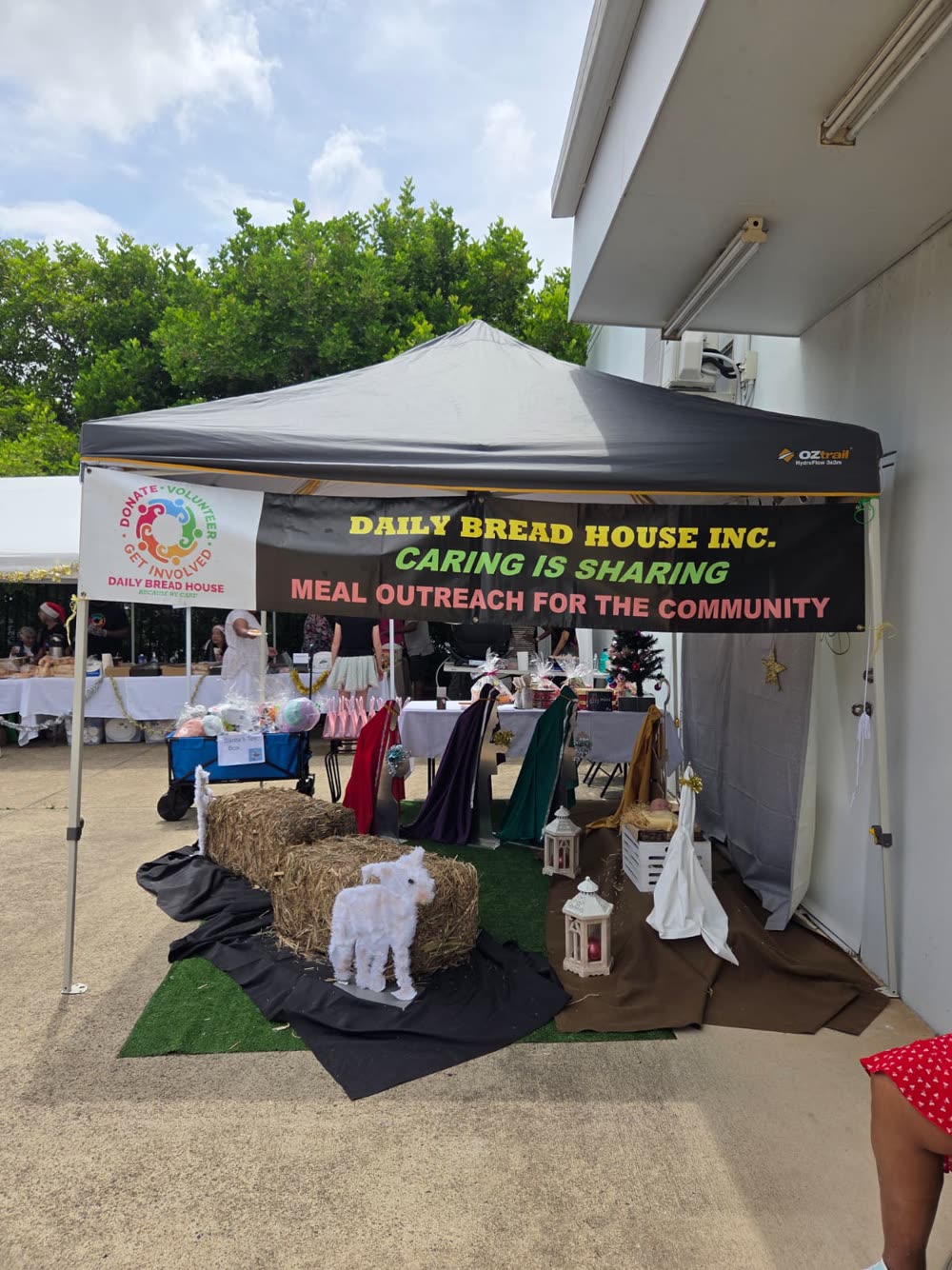 The Daily Bread House Inc banner reading Caring is Sharing, Meal Outreach for the Community.
